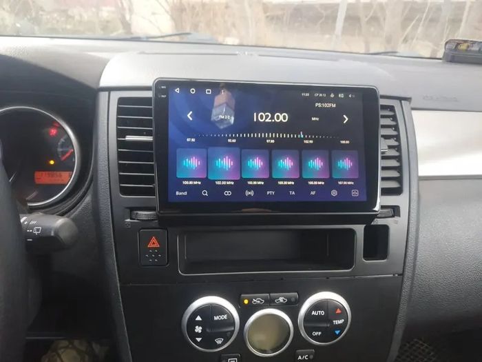 Магнитола для Nissan Tiida C11 2004-2013 (климат с круглым экранчиком, рамка черная) - FarCar DX9-1148CLB монитор 9.5" IPS на Android 13, 4+64Гб, CarPlay